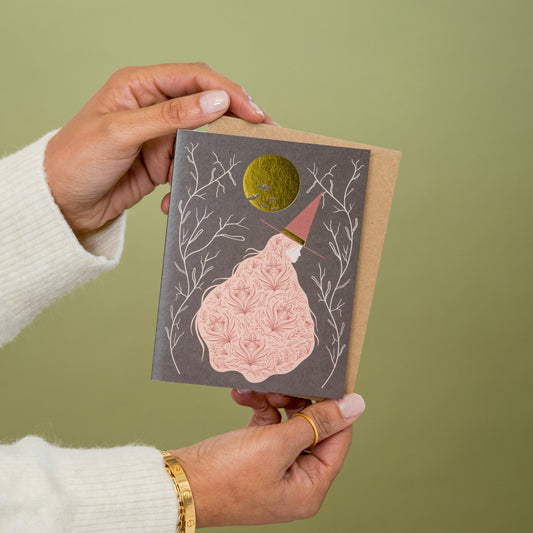Witch's Moon greeting card held in hand