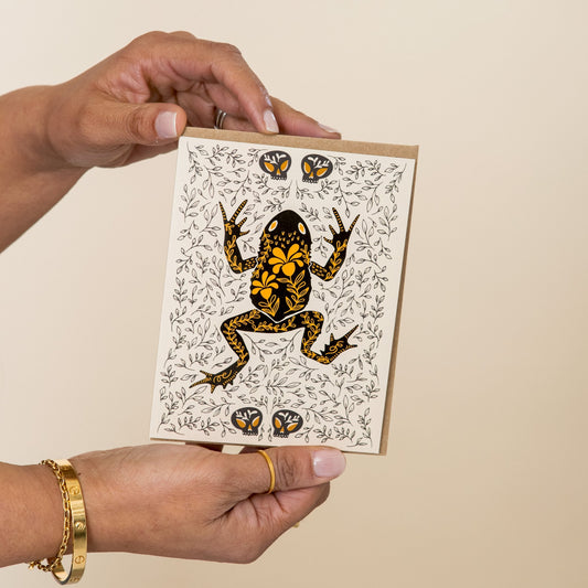 Toad Dark Omens greeting card held in hand