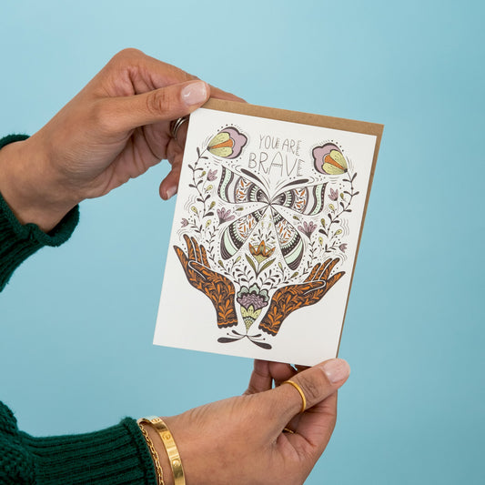 You Are Brave greeting card held in hand