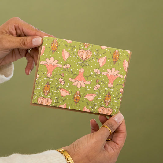 Love Bugs greeting card held in hand