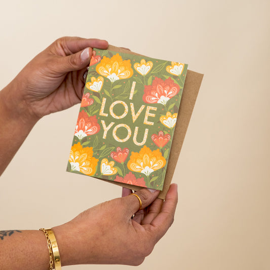 Flower Love greeting card held in hand