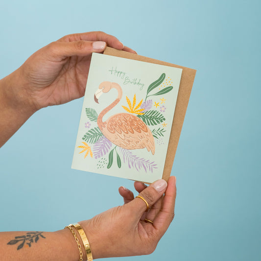 Flamingo Garden Birthday greeting card held in hand