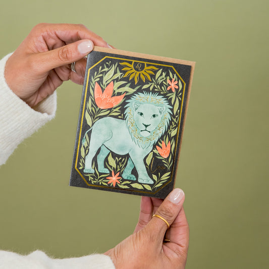 Leo Zodiac Garden greeting card held in hand