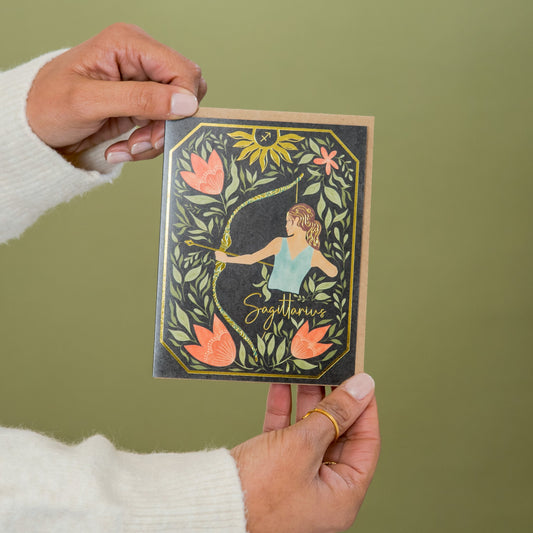 Sagittarius Zodiac Garden greeting card held in hand