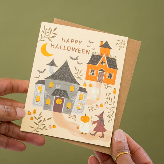 Trick or Treat Night Halloween greeting card held in hand