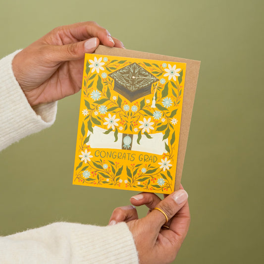 Classic Grad Graduation greeting card held in hand