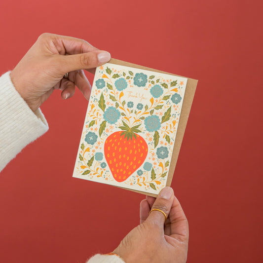 Strawberry Thank You greeting card held in hand