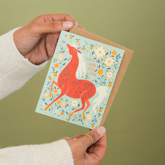 Lunar New Year Horse greeting card held in hand