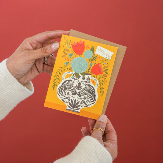 Zebra Vase Birthday greeting card held in hand