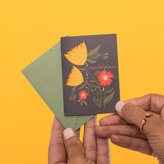 Congratulations Tulips mini card held in hand