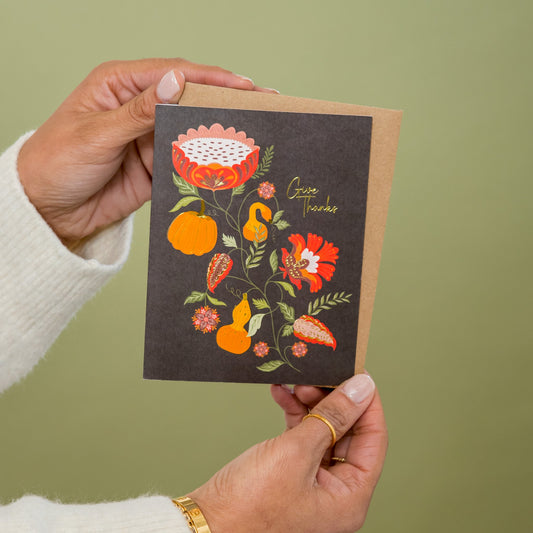 Pumpkin Garden Give Thanks greeting card held in hand