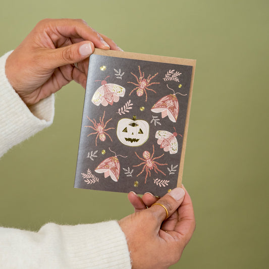 Spooky Spirits Halloween greeting card held in hand