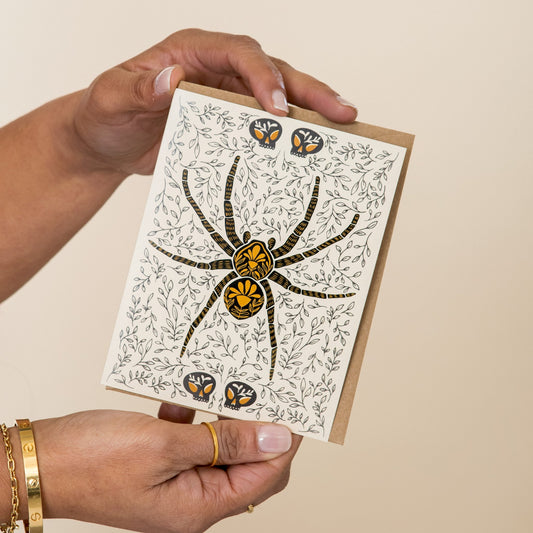 Spider Dark Omens greeting card held in hand