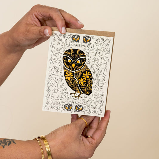 Owl Dark Omens greeting card held in hand