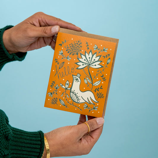 Hello Bird greeting card held in hand