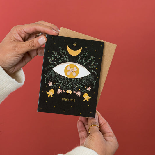 Mystic Eye Thank You greeting card held in hand