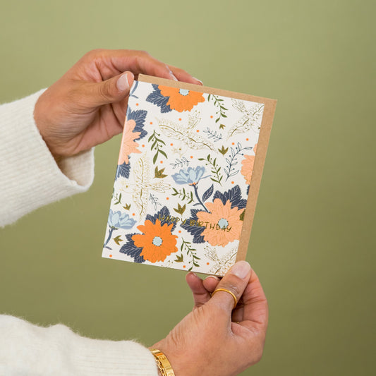 Happy Birthday Birds greeting card held in hand