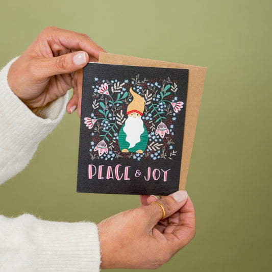 Berry Gnome Holiday greeting card held in hand