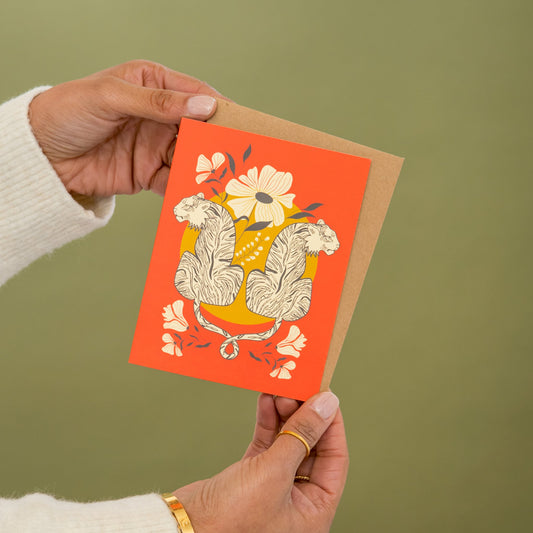 Intwined Tiger greeting card held in hand