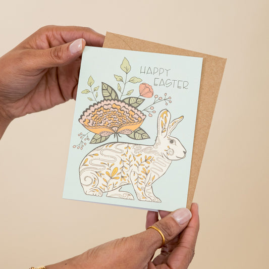 Easter Blossom Bunny greeting card held in hand