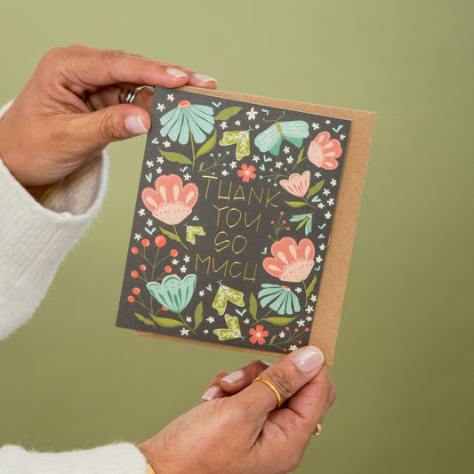 May Flowers Thank You greeting card held in hand