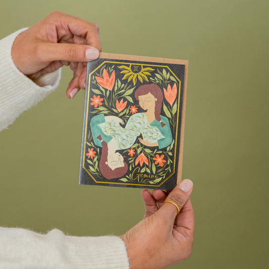 Gemini Zodiac Garden greeting card held in hand