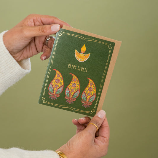 Diwali Lamp greeting card held in hand
