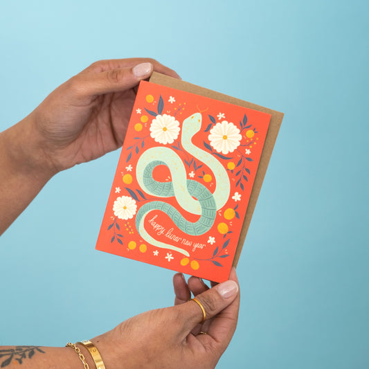 Lunar New Year Snake greeting card held in hand