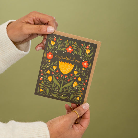 Congratulations Tulips greeting card held in hand