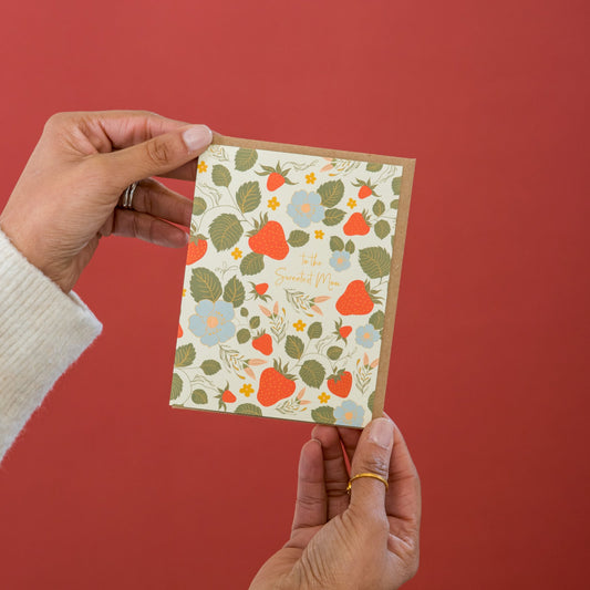 Strawberry Garden Mother's Day greeting card held in hand