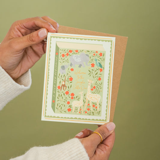 Jungle Welcome for Baby greeting card held in hand