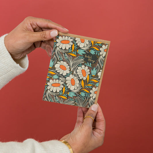 Thankful Always greeting card held in hand
