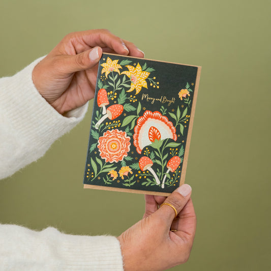 Merry and Bright greeting card held in hand