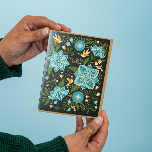 Full Bloom Holiday greeting card held in hand
