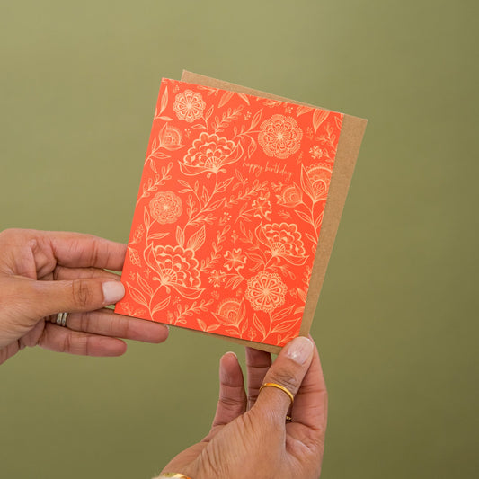 Floral Happy Birthday greeting card held in hand