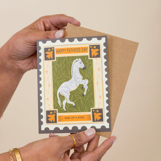 Zebra One of a Kind Father's Day greeting card held in hand