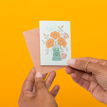 Hello Flowers mini card held in hand