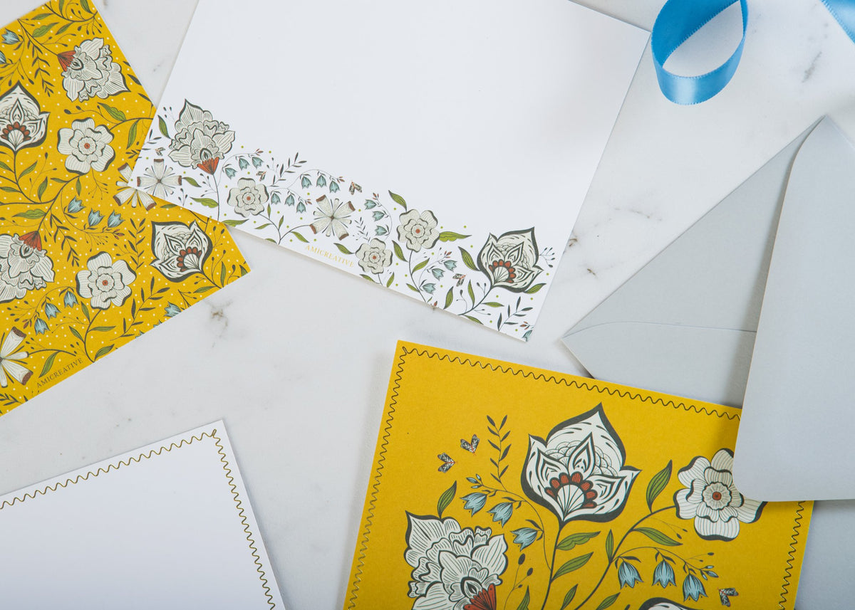 Close-up of Ochre Garden notecard with gold foil details