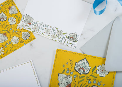 Close-up of Ochre Garden notecard with gold foil details