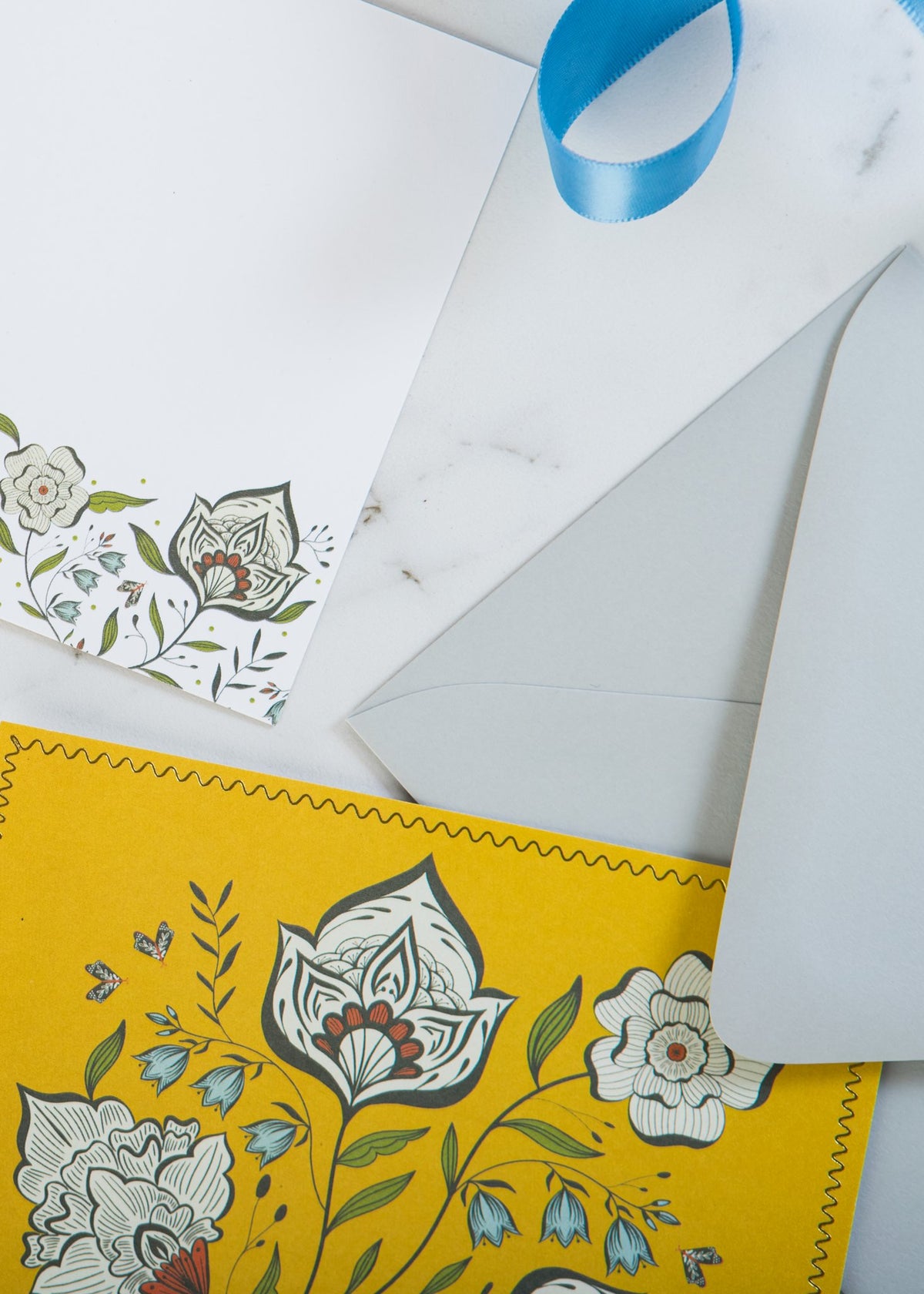 Close-up of Ochre Garden notecard with gold foil details