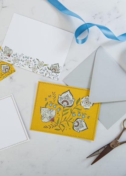 Close-up of Ochre Garden notecard with gold foil details