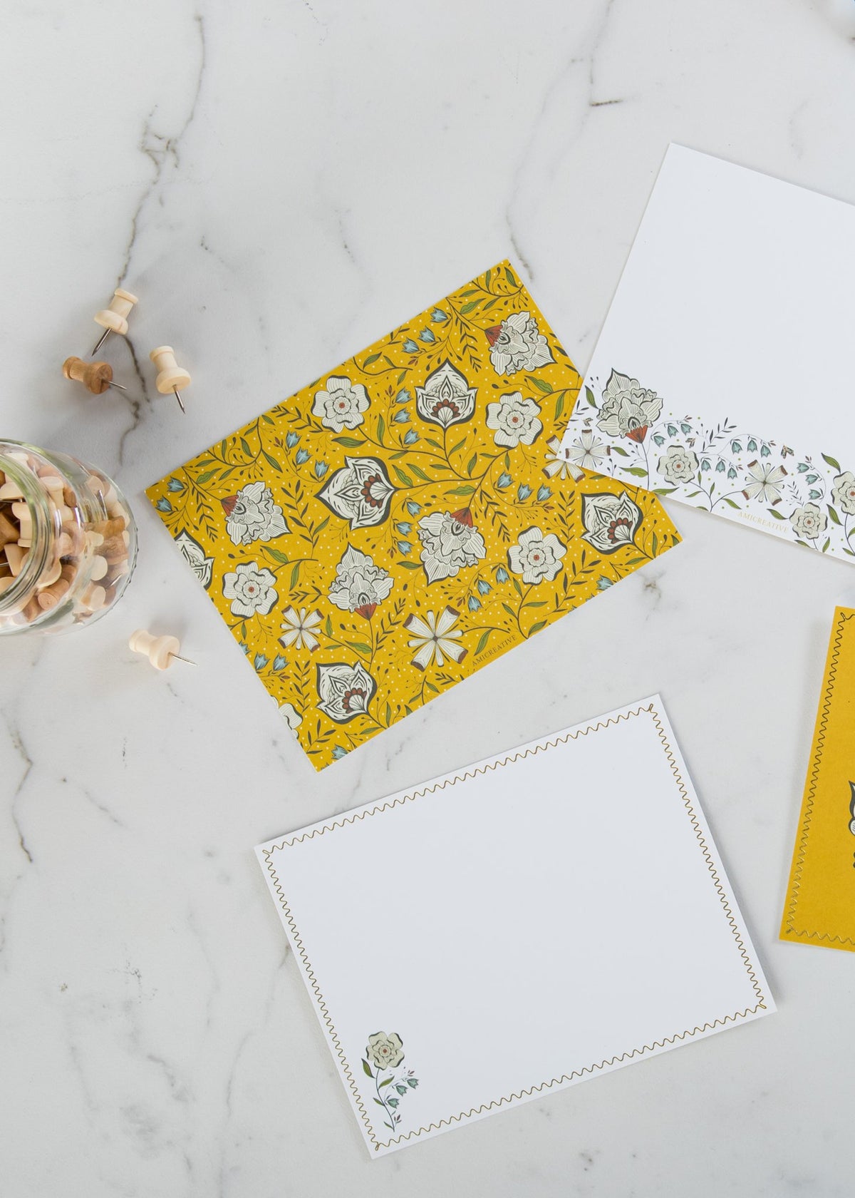 Close-up of Ochre Garden notecard with gold foil details