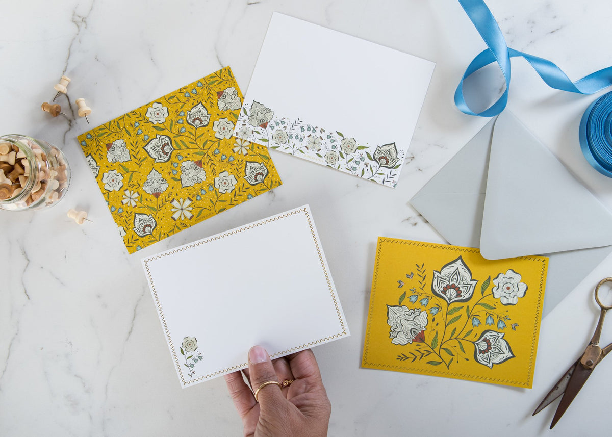 Ochre Garden notecard held in hand