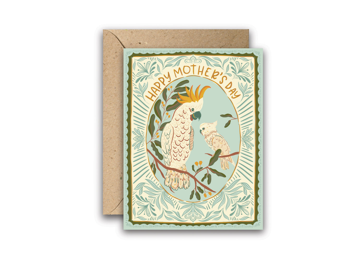 Cockatoo Love Mother’s Day gold foil greeting card featuring a mother cockatoo and baby perched on a branch, framed by an ornate blue and green scalloped border with delicate florals and shimmering “Happy Mother’s Day” lettering.