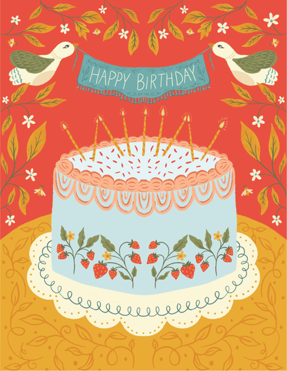 Strawberry Cake Birthday Greeting Card featuring a hand-illustrated blue cake with strawberry details, lit candles, and two birds holding a “Happy Birthday” banner on a bold red background with floral accents.