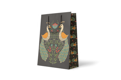 Peacock Garden Large Gift Bag, hand-illustrated peacocks among layered florals on deep charcoal by Amita Nair